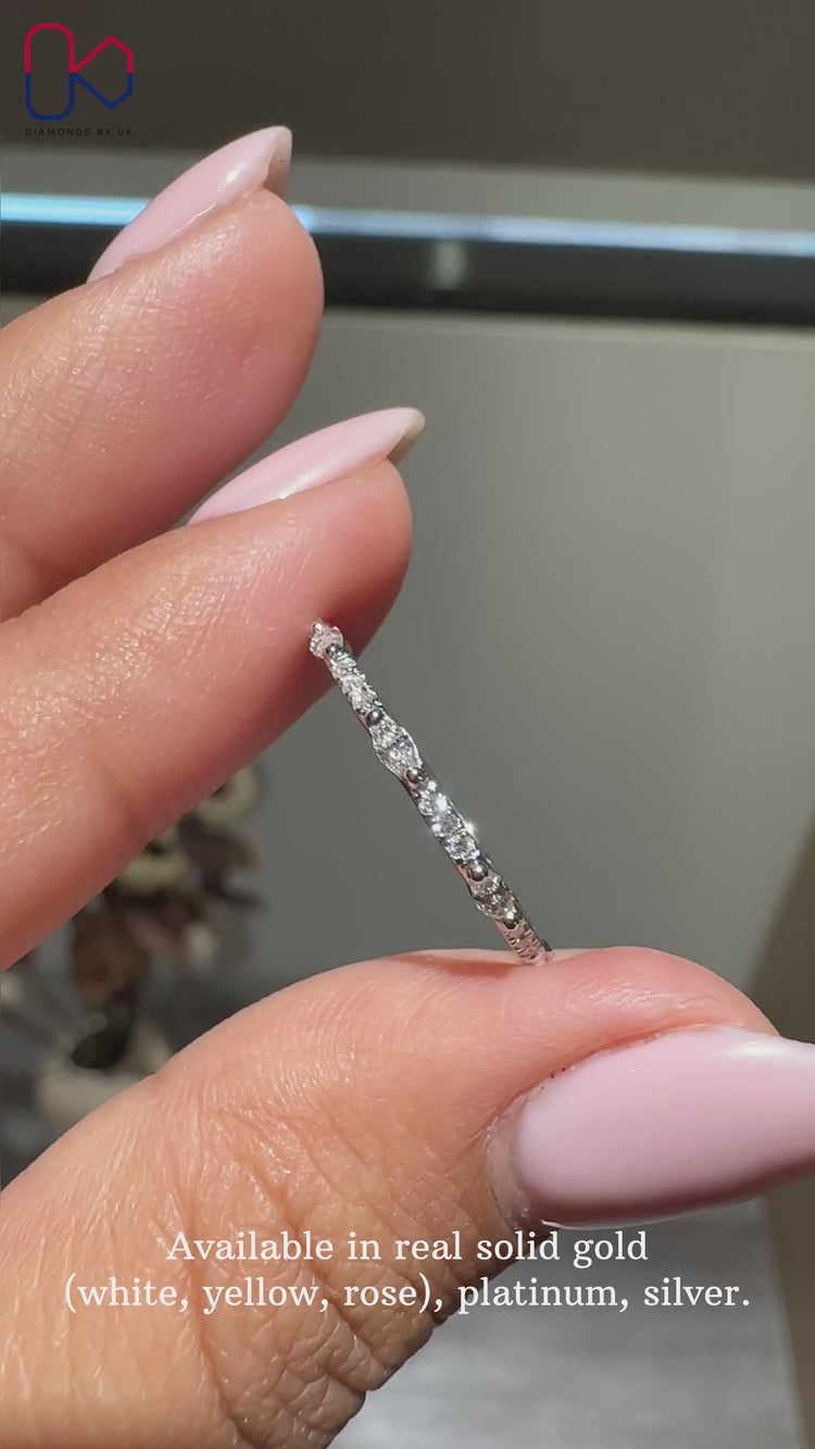 Marquise and round wedding band featuring a timeless design.
