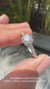 Round cut ring featuring a beautiful three stone engagement ring with diamonds.