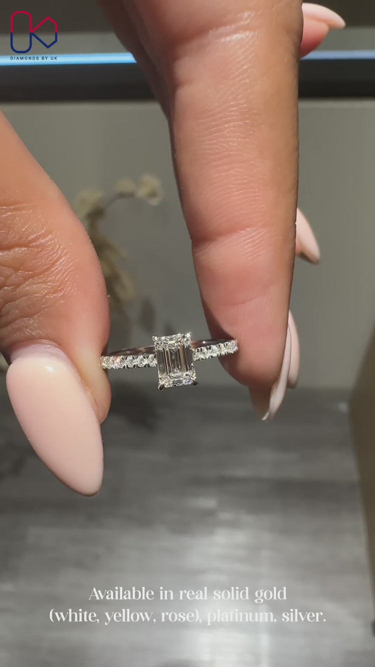 White gold engagement ring with emerald cut center

