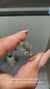 Cathedral emerald cut diamond ring with prongs.