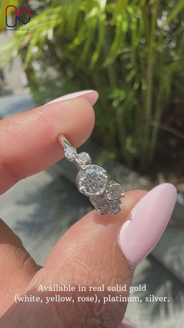 Round cut diamond ring with sparkling accents.
