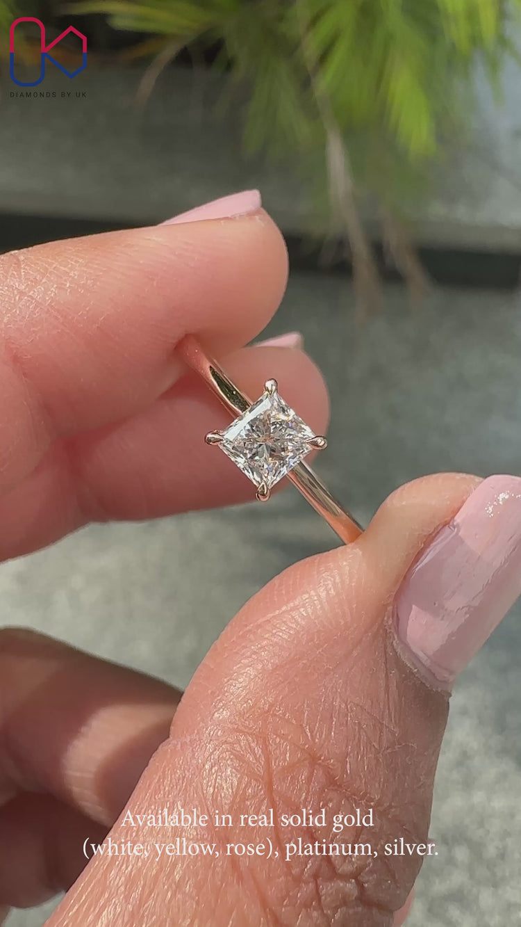 Rose gold engagement ring with princess cut center stone.