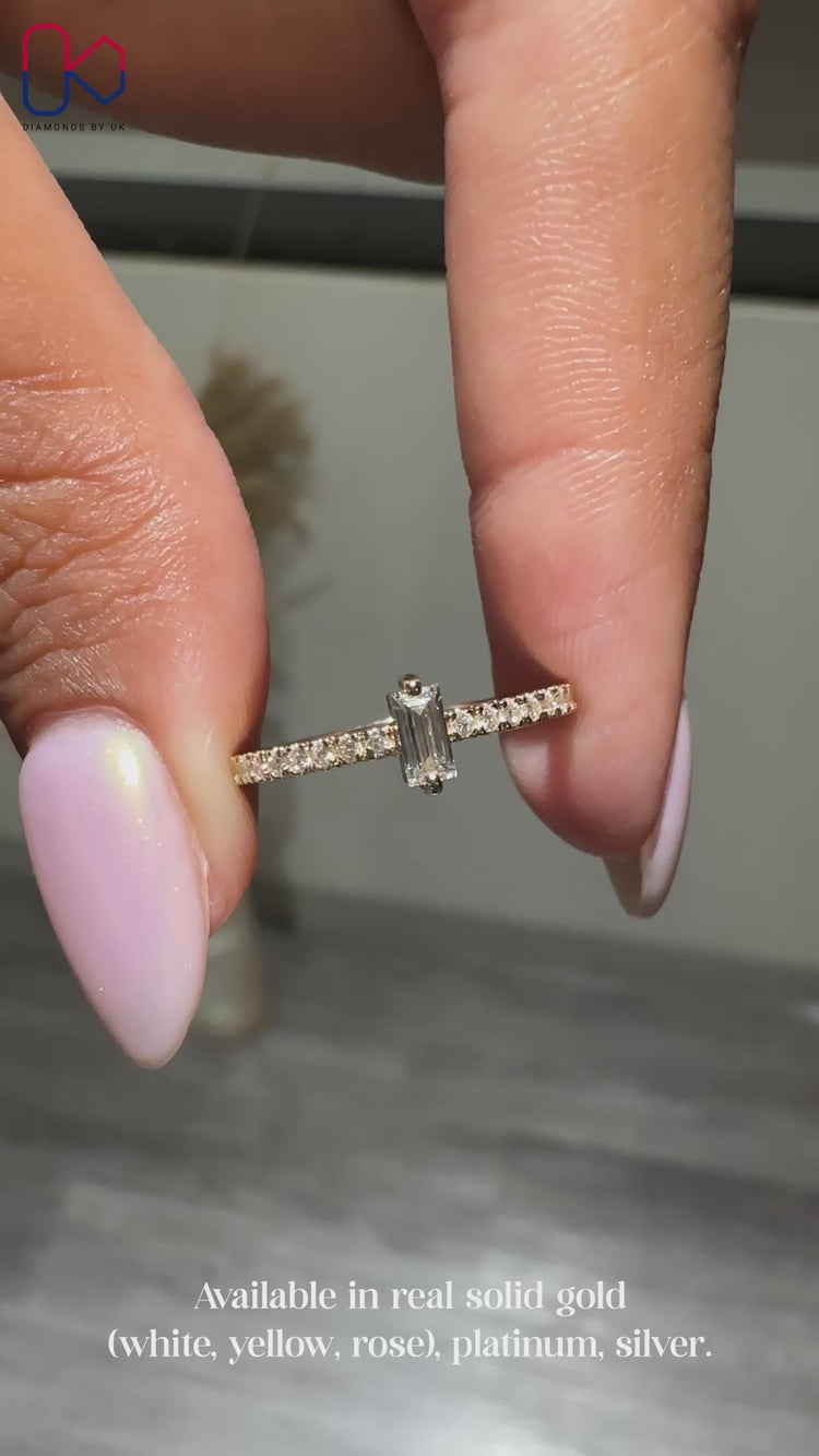 Yellow gold half eternity band and round cut stone.
