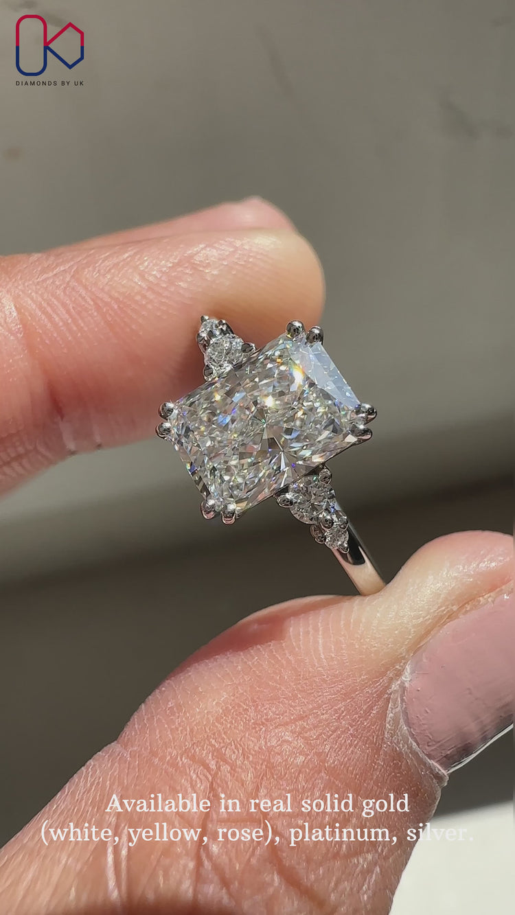 Double claw prong setting showcasing a radiant cut diamond.