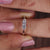 Round diamond wedding band crafted with a prong setting.

