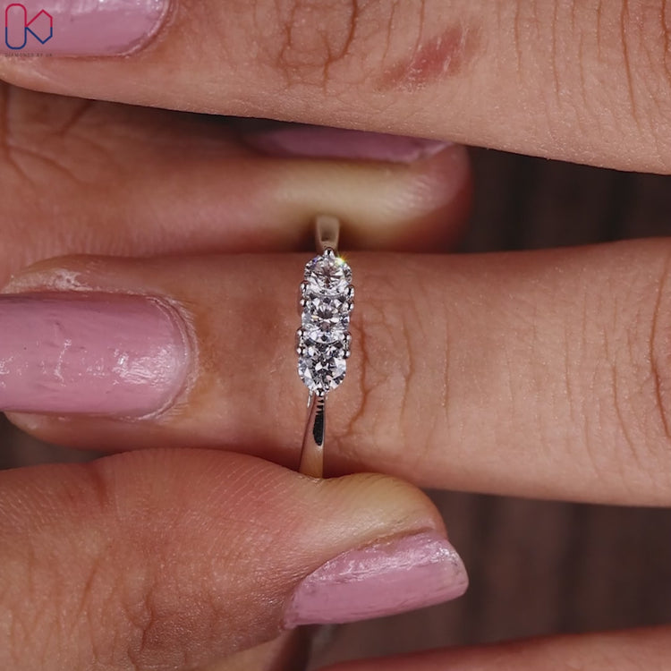 Round diamond wedding band crafted with a prong setting.
