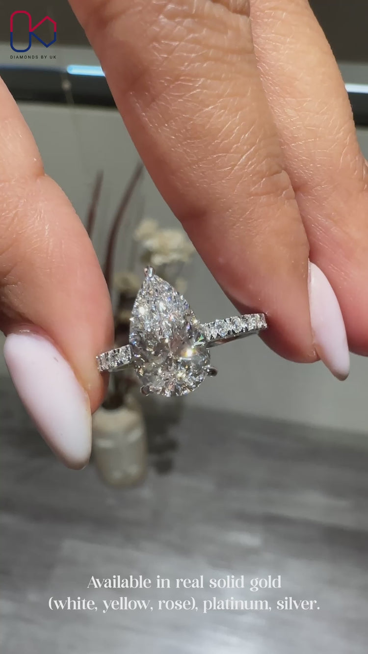 Pear cut diamond ring featuring a unique shape.
