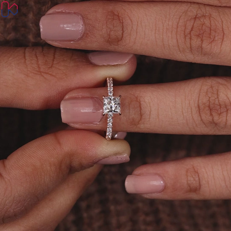 Rose gold ring with princess and round cut diamonds.