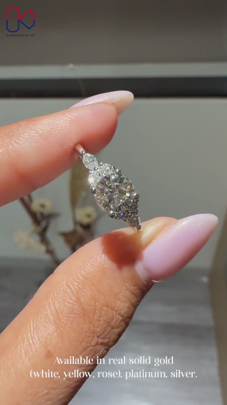 Round cut diamond ring with tapered shank design.