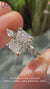 3 stone ring featuring a radiant cut diamond ring and yellow gold diamond ring band.
