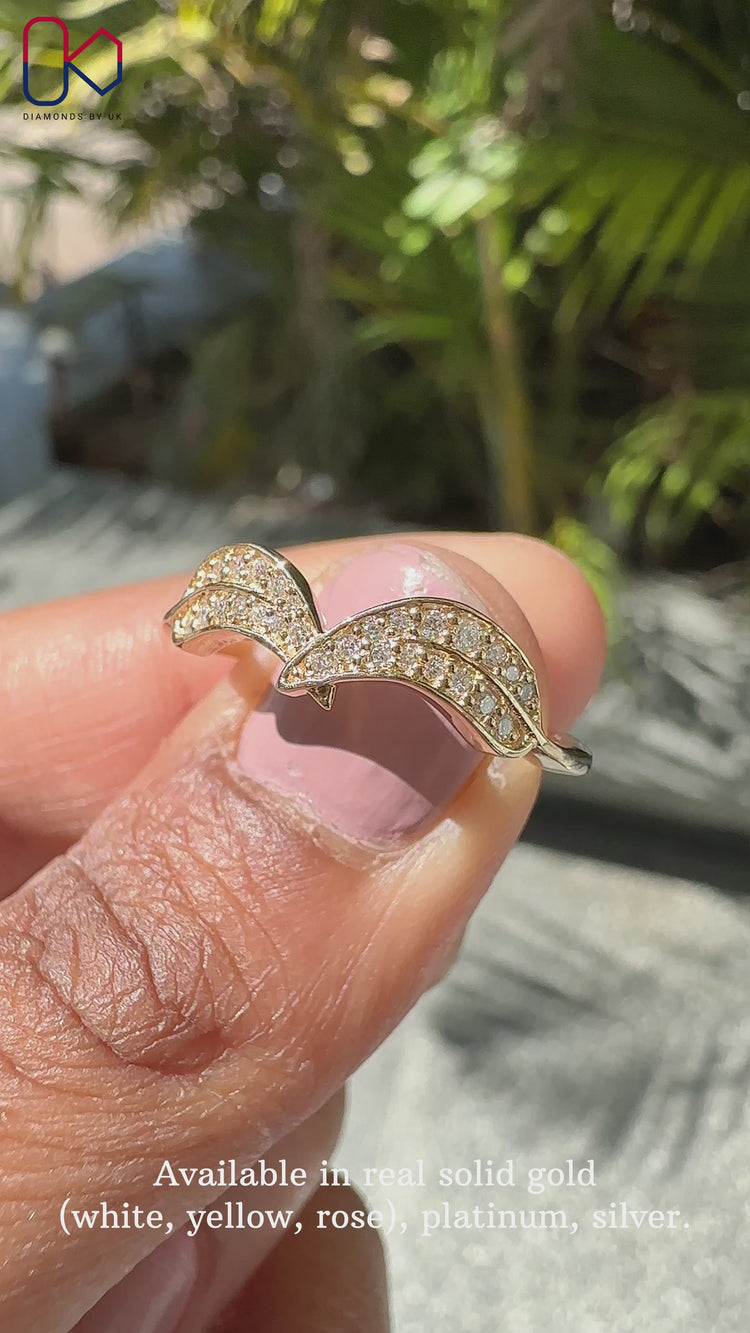 Round diamond engagement ring set in a yellow gold band.
