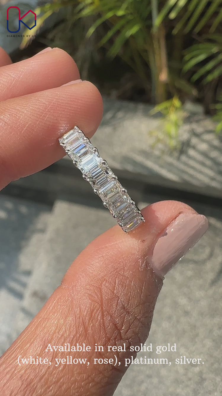 Emerald cut band with half eternity prong setting.
