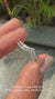 Curved diamond band paired with half eternity band in white gold.
