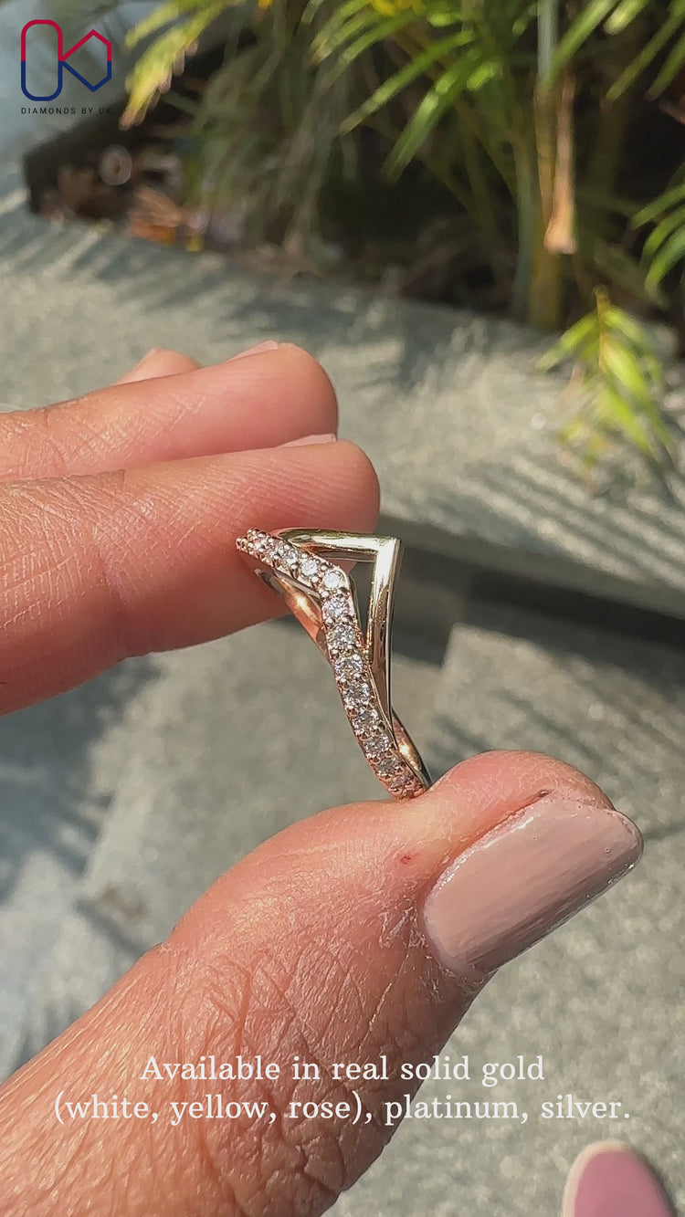 Round cut diamond band handcrafted in rose gold.
