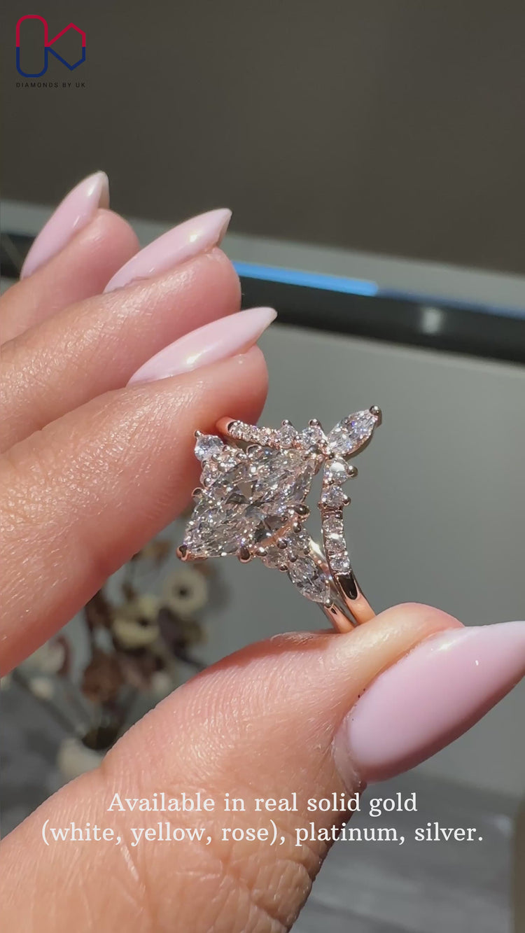 Marquise diamond ring with a polished band design.
