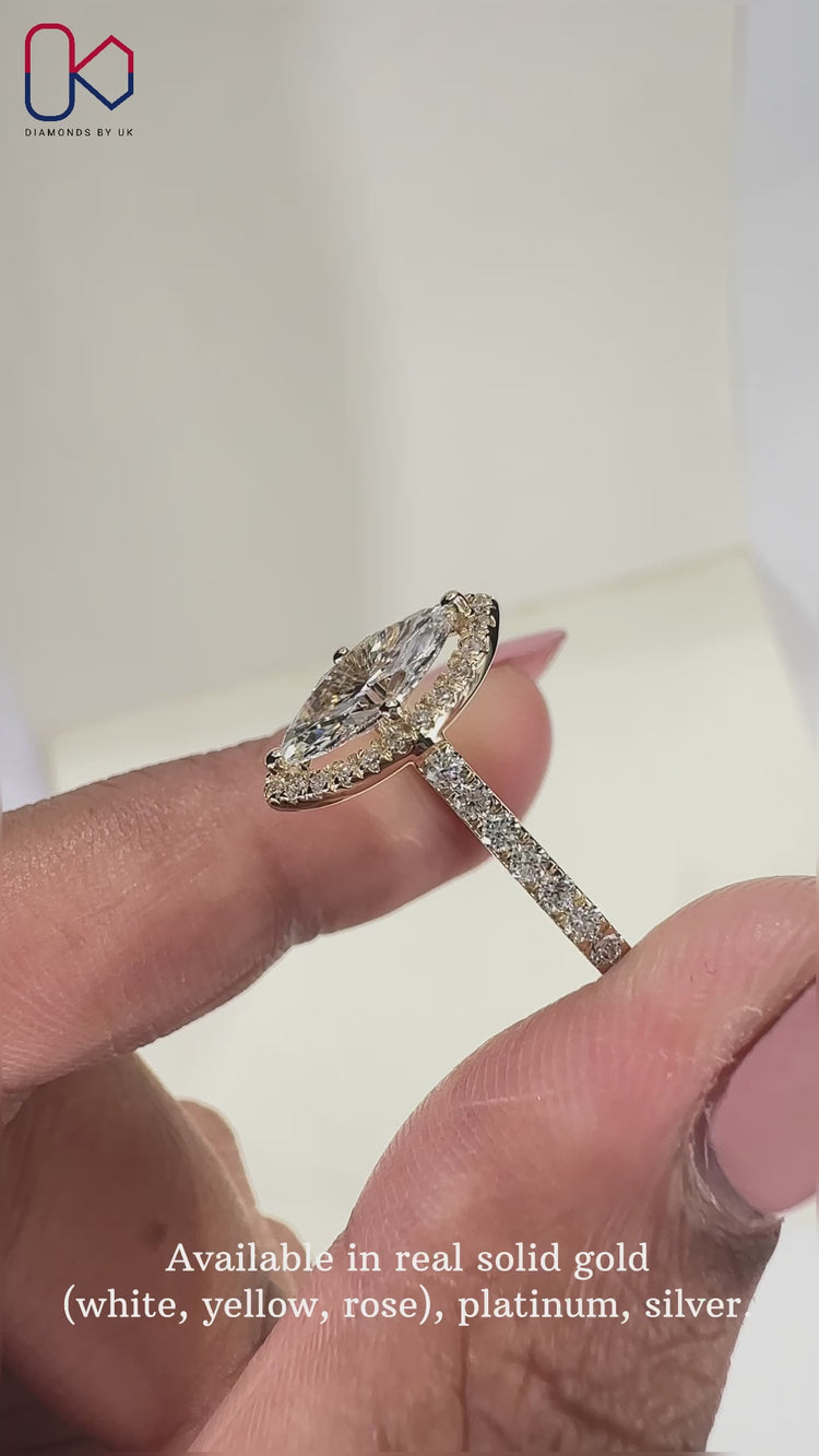 Halo engagement ring with sparkling surround.
