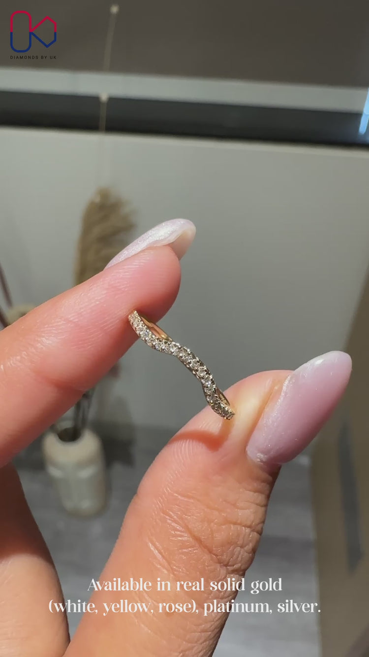 Round diamond band with curved shape.
