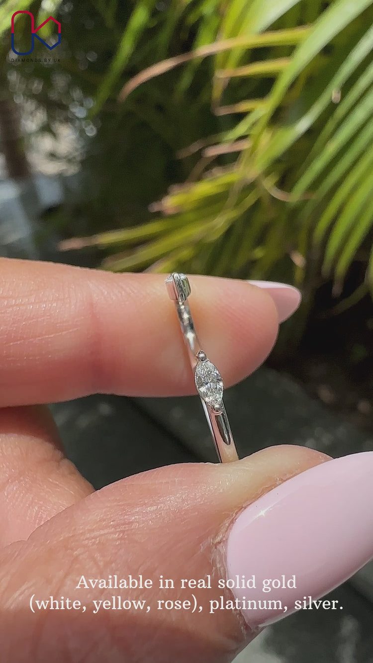 Marquise wedding band featuring beautifully cut diamonds for a unique sparkle.
