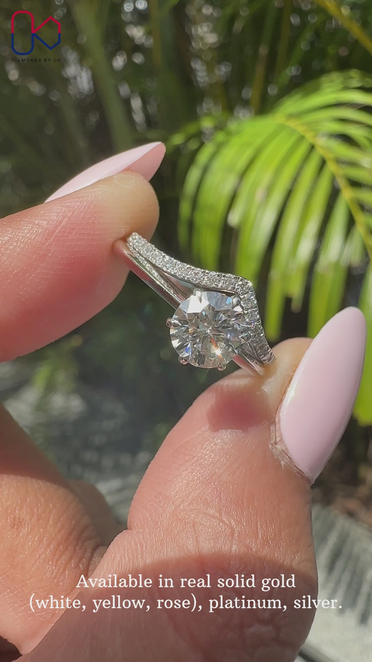 Solitaire setting ring with knife edge shank and round diamond wedding band.
