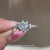 IGI certified princess cut diamond ring with pavé.
