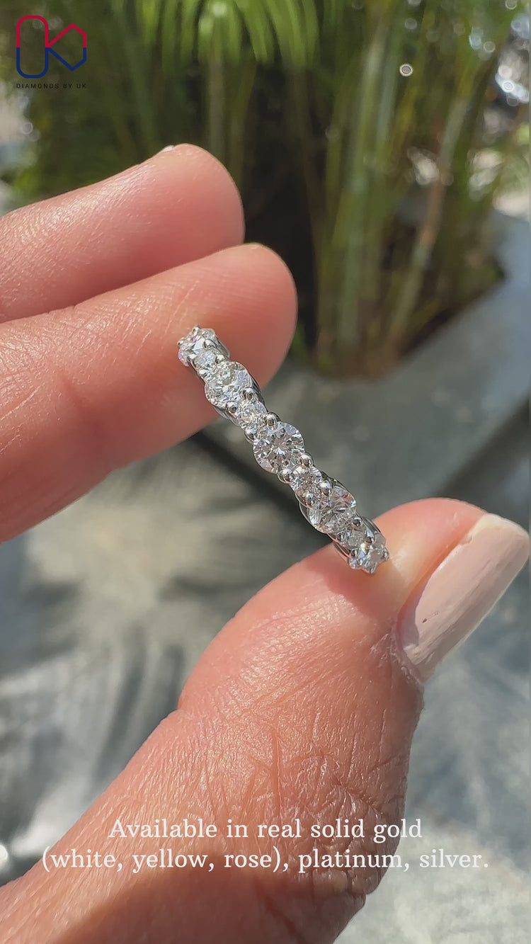 Round diamond wedding band with handmade prong setting.