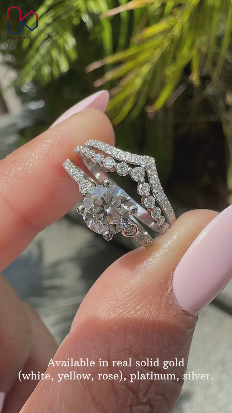 Round cut diamond ring with prong setting and double row wedding band.
