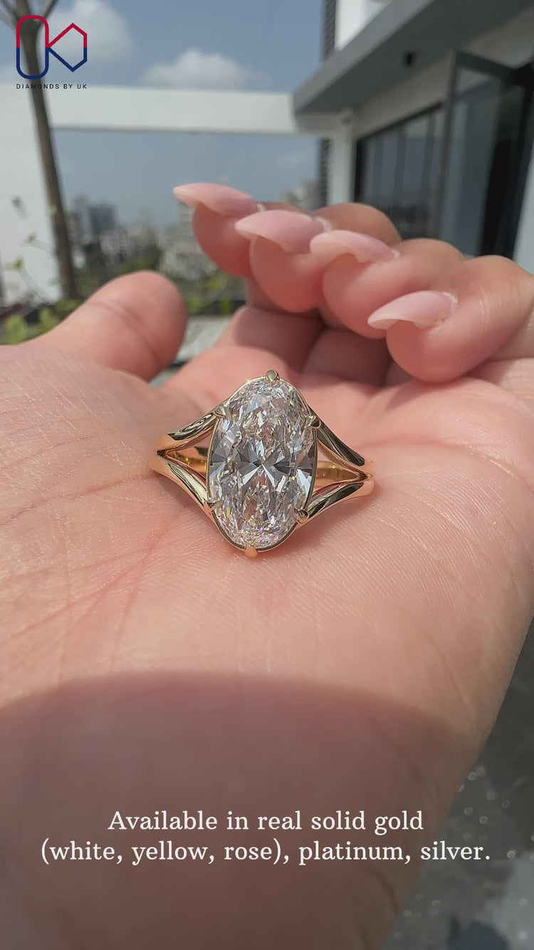 Oval cut engagement ring with 6 claw prong setting.
