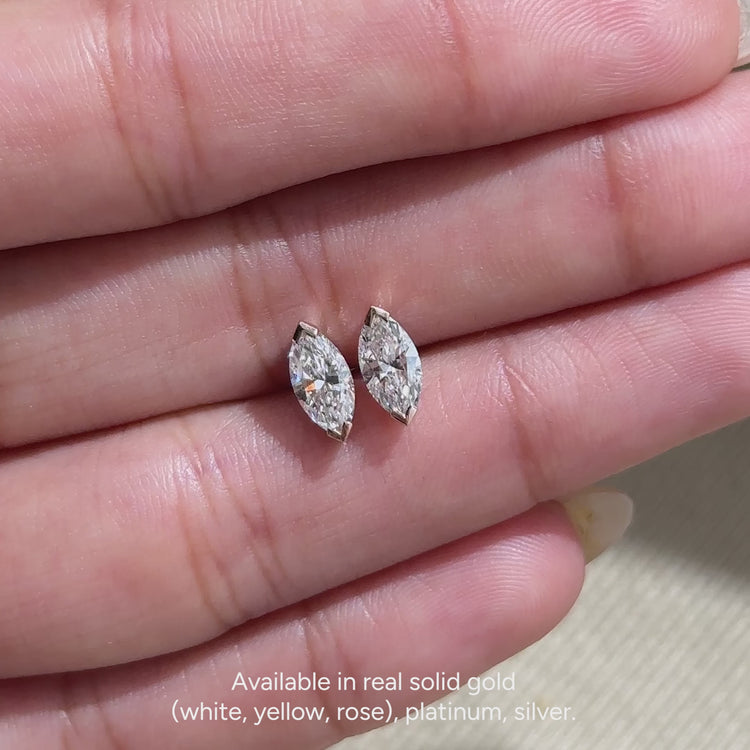 Marquise diamond earrings with a V prong setting.