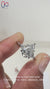Muse setting ring with round side stones.

