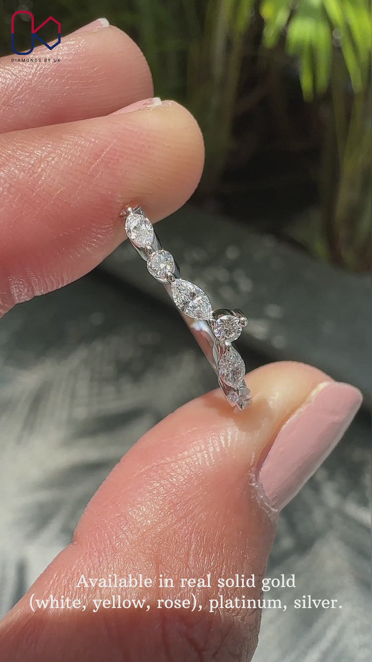 Marquise and round diamond band offering a blend of classic and modern styles.
