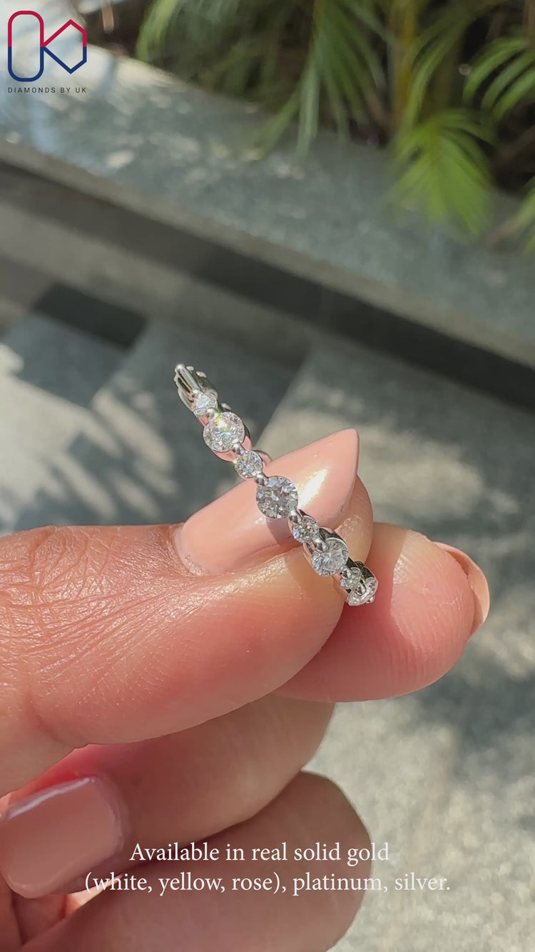 A round diamond wedding band set in elegant white gold for timeless beauty.