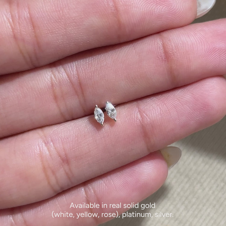 Handmade solitaire marquise diamond earrings.