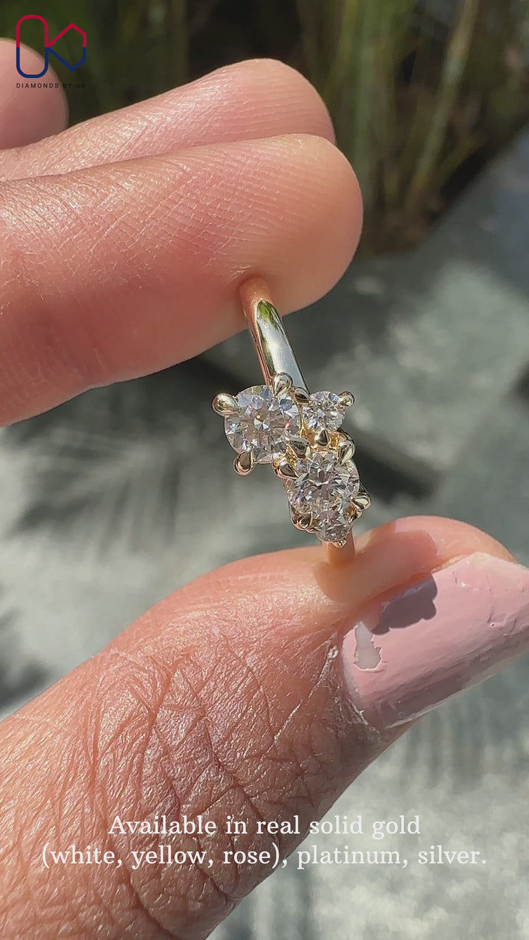 Round diamond ring with claw prong setting.
