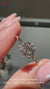 Round diamond engagement ring with delicate handmade jewelry design.
