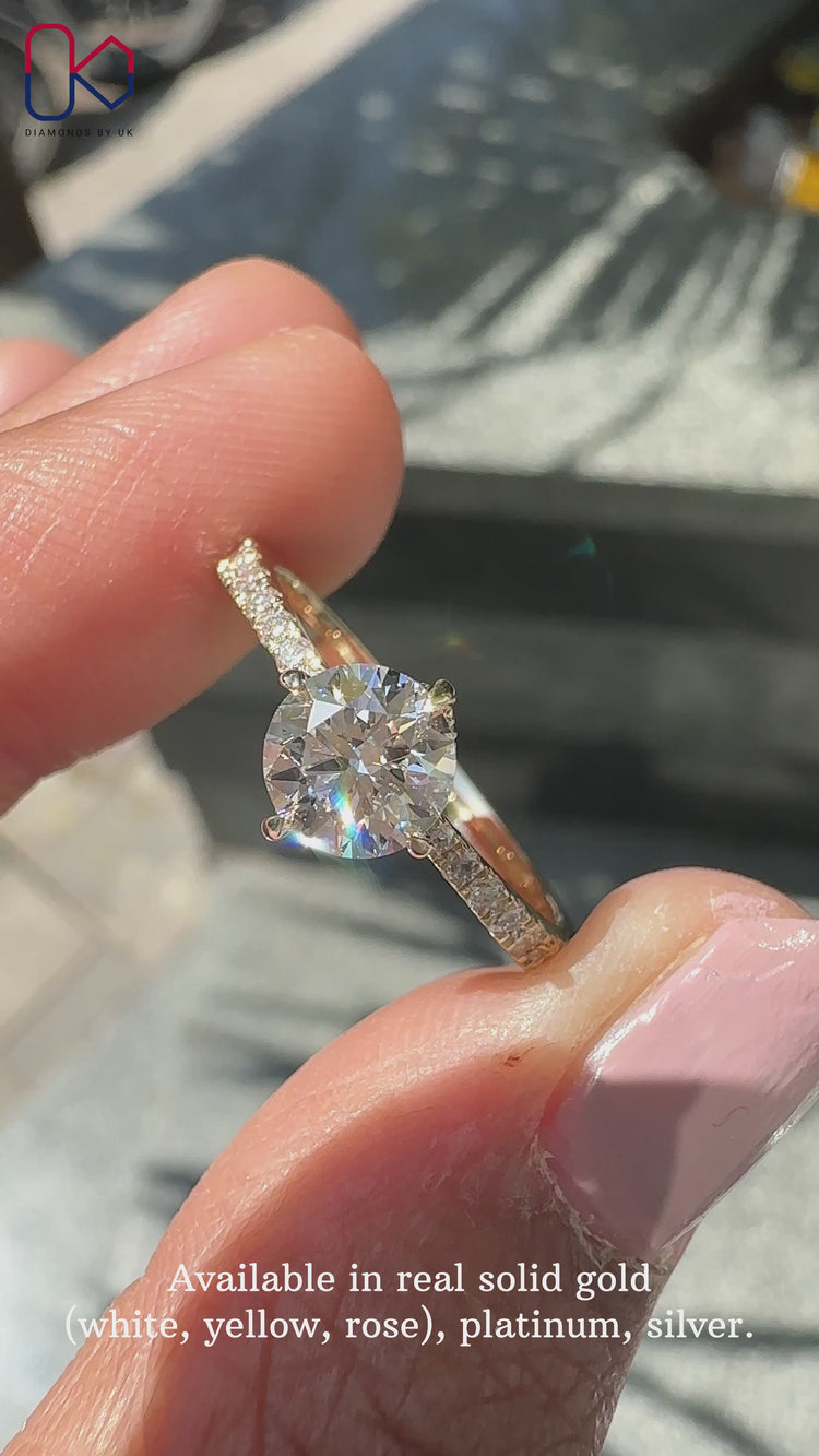 Round diamond ring set in a pave setting ring for extra brilliance.
