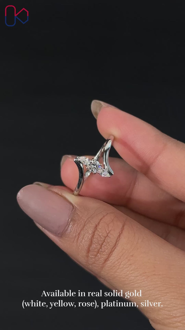Round and pear cut engagement ring design
