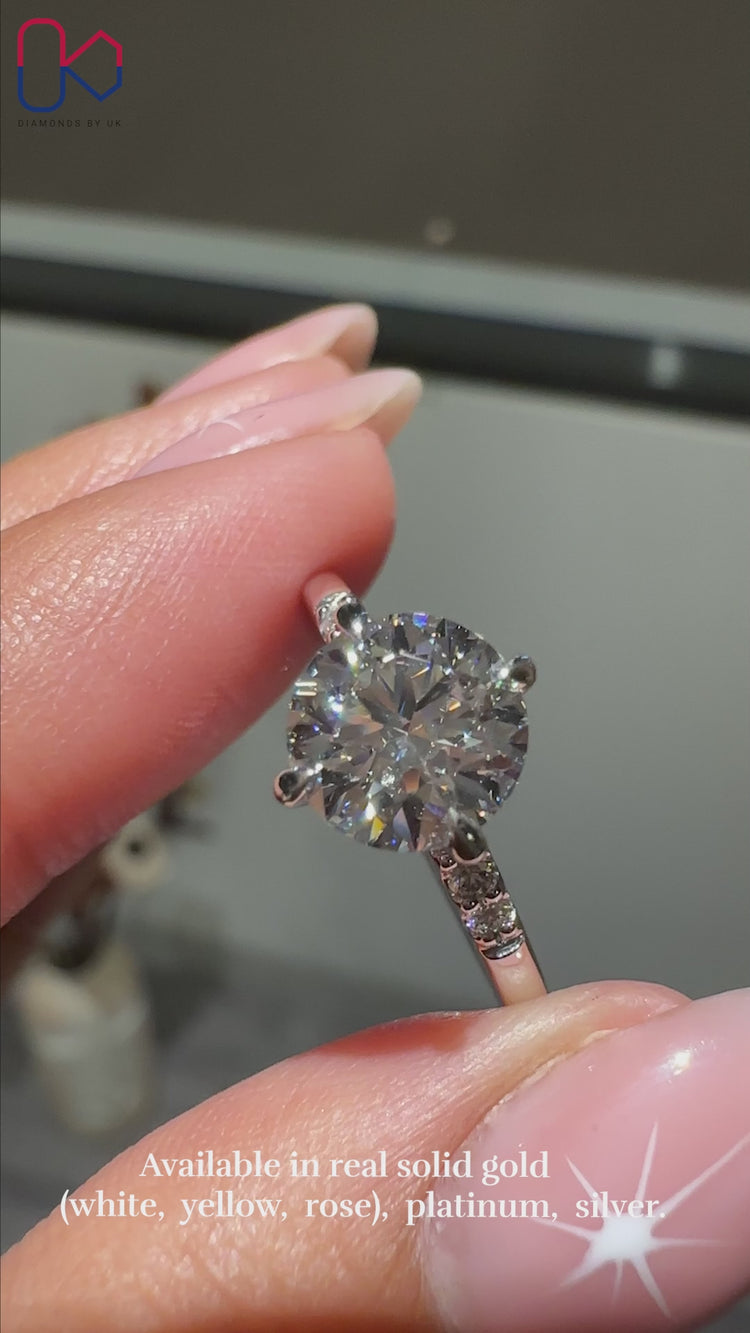 White gold diamond ring with Round cut stone.
