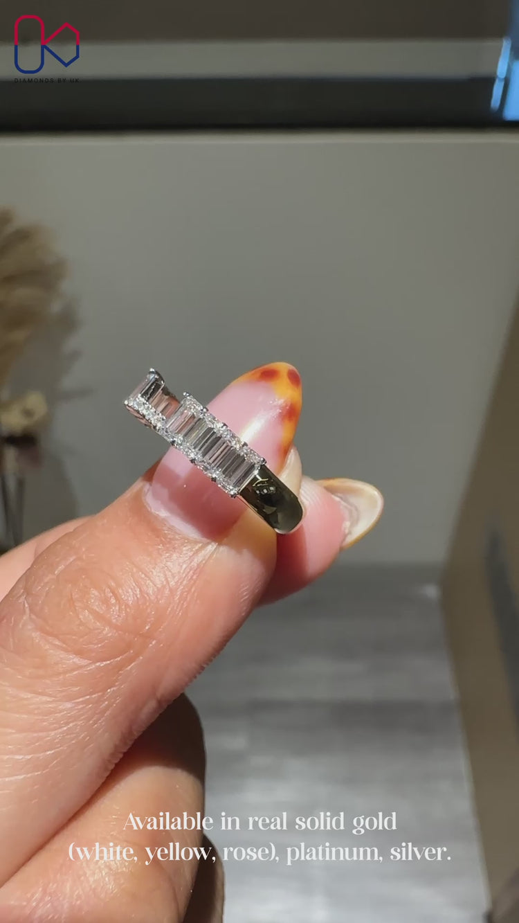 Emerald and round diamond band with u-prong setting.
