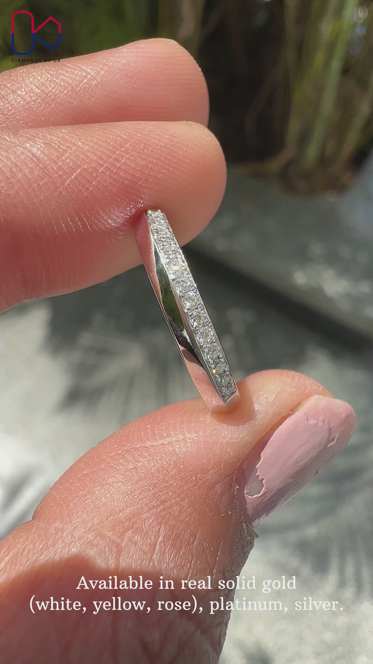 Stunning round diamond wedding band showcasing flawless brilliance.
