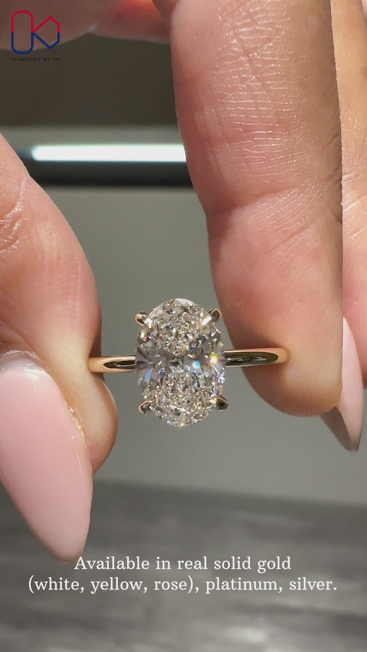 Solitaire engagement ring with oval cut diamond.
