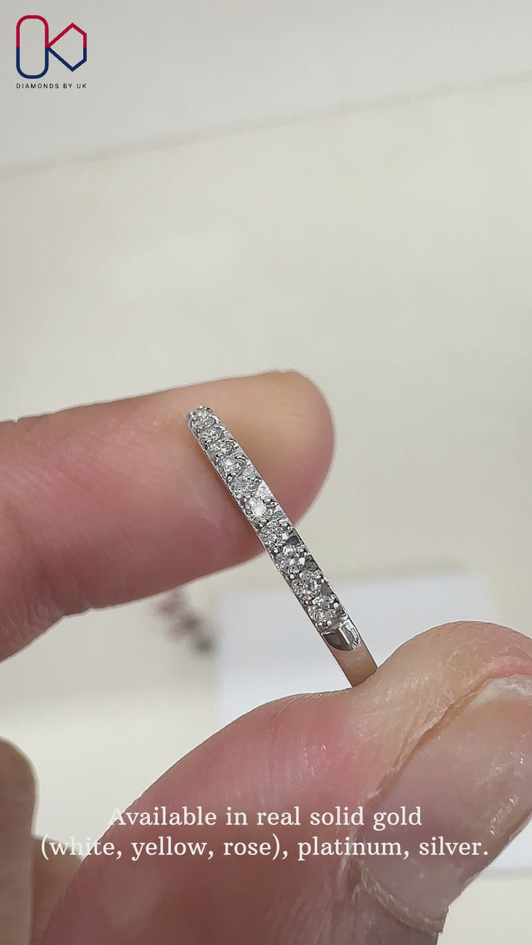 Lab grown round diamond band with prong setting.