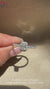 Radiant cut ring with round diamond pavé band.