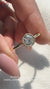 Round diamond engagement ring and yellow gold engagement ring.
