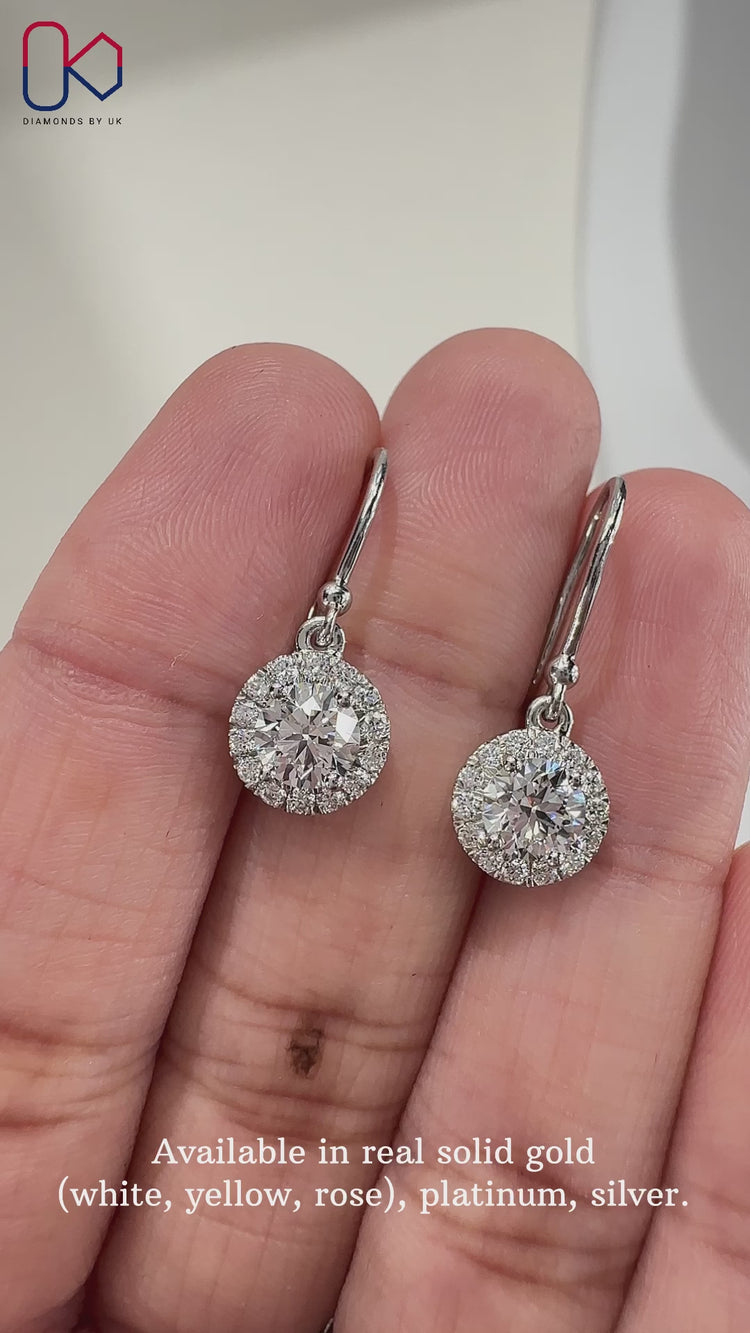 Classic round diamond earrings for a timeless look.
