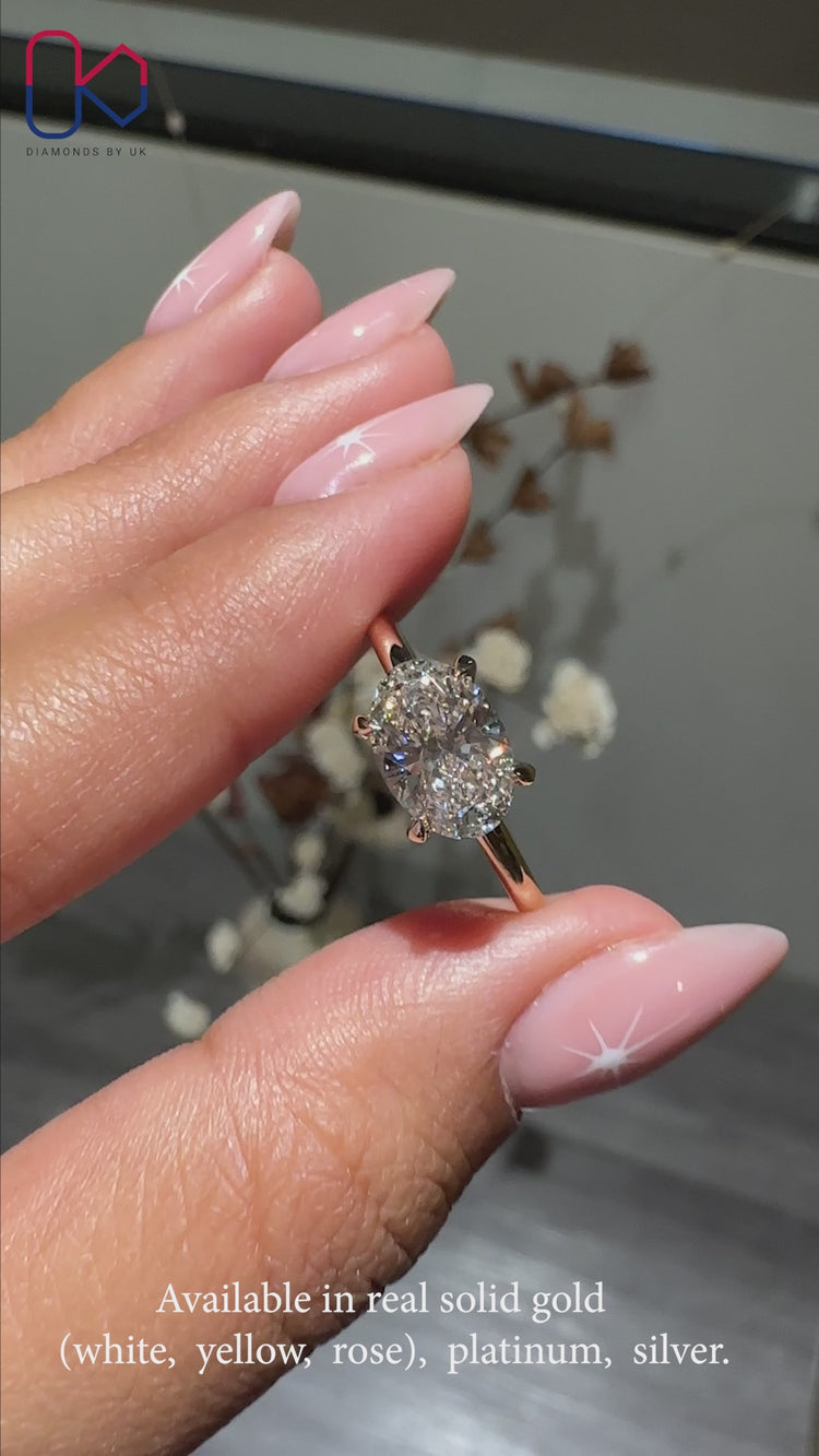 Elegant oval diamond ring set in a classic design.
