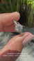 Round diamond engagement ring with prong setting in white gold.
