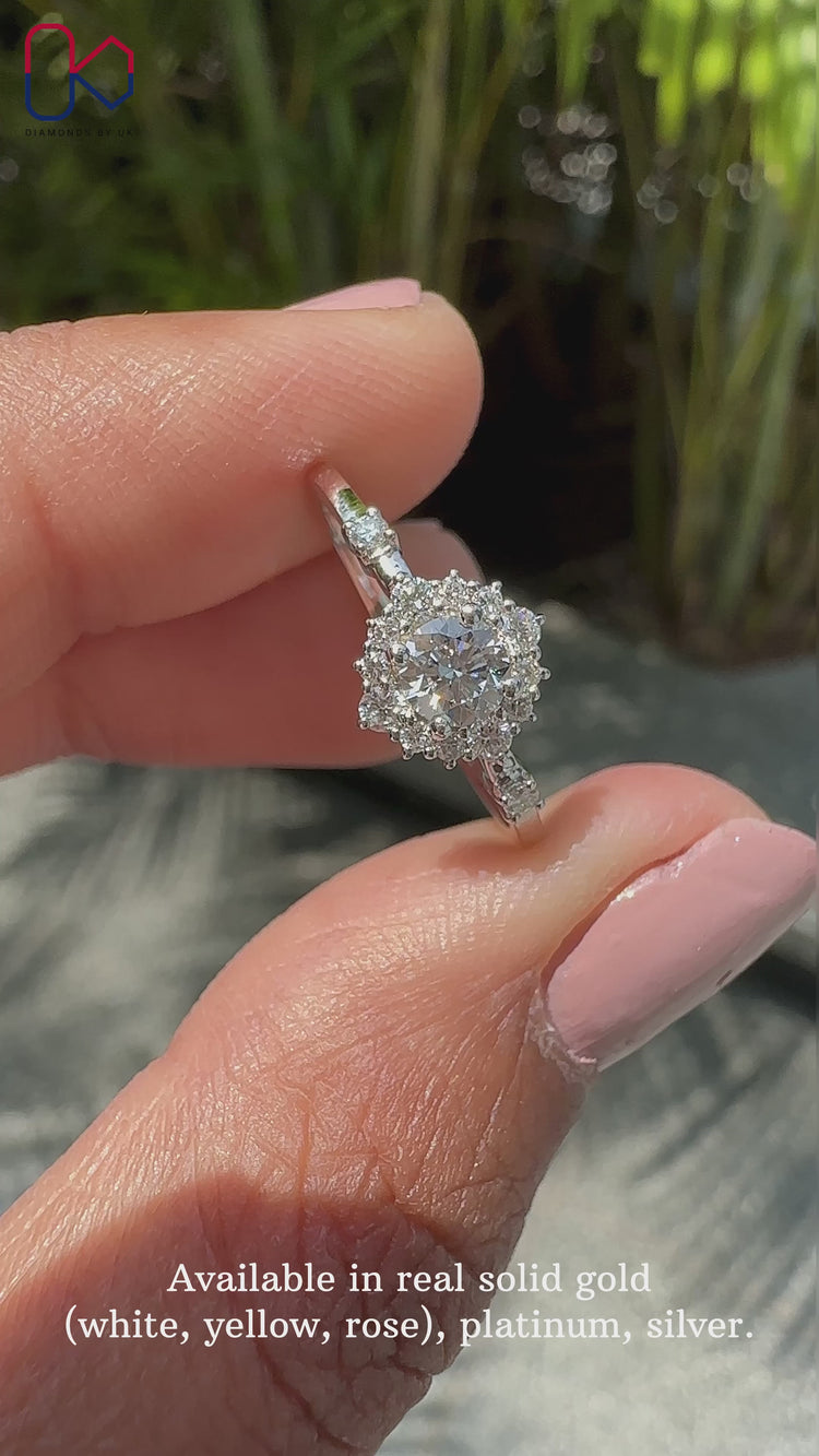 Round diamond engagement ring with prong setting in white gold.
