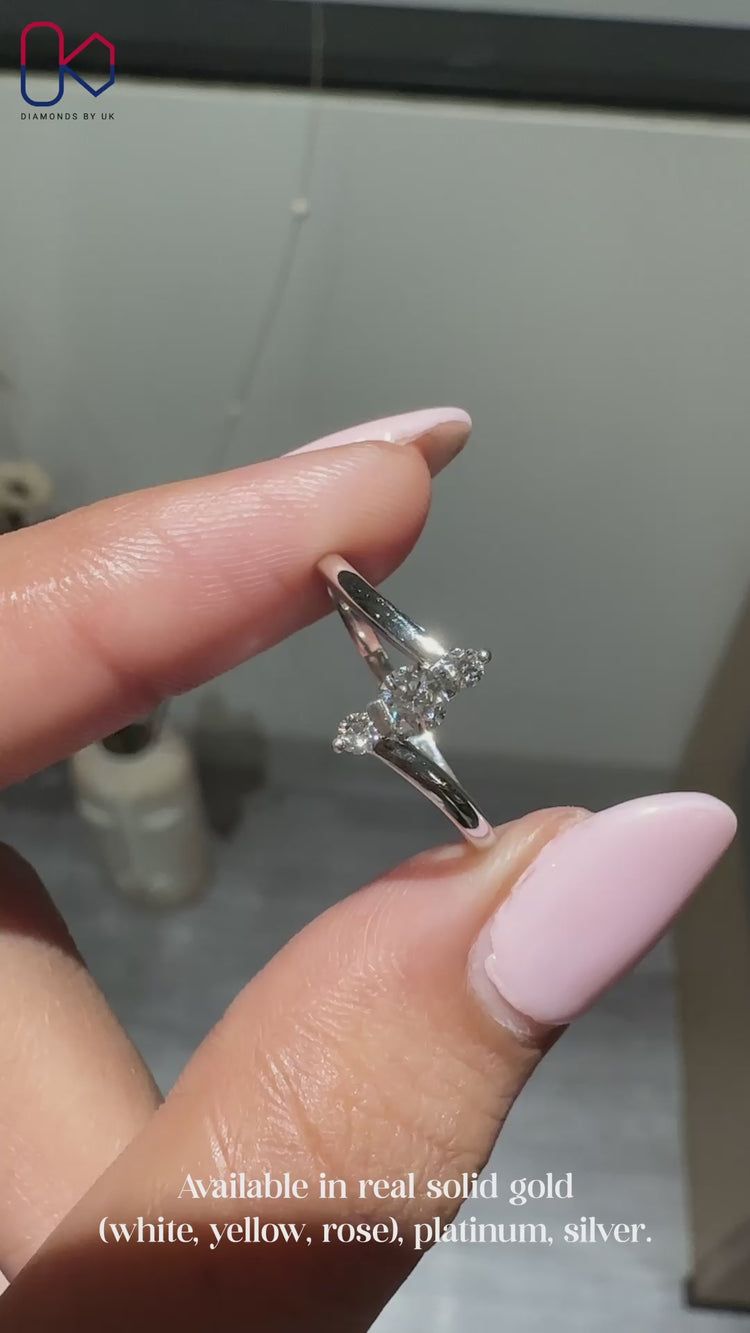 IGI Certified three stone ring with round diamond.
