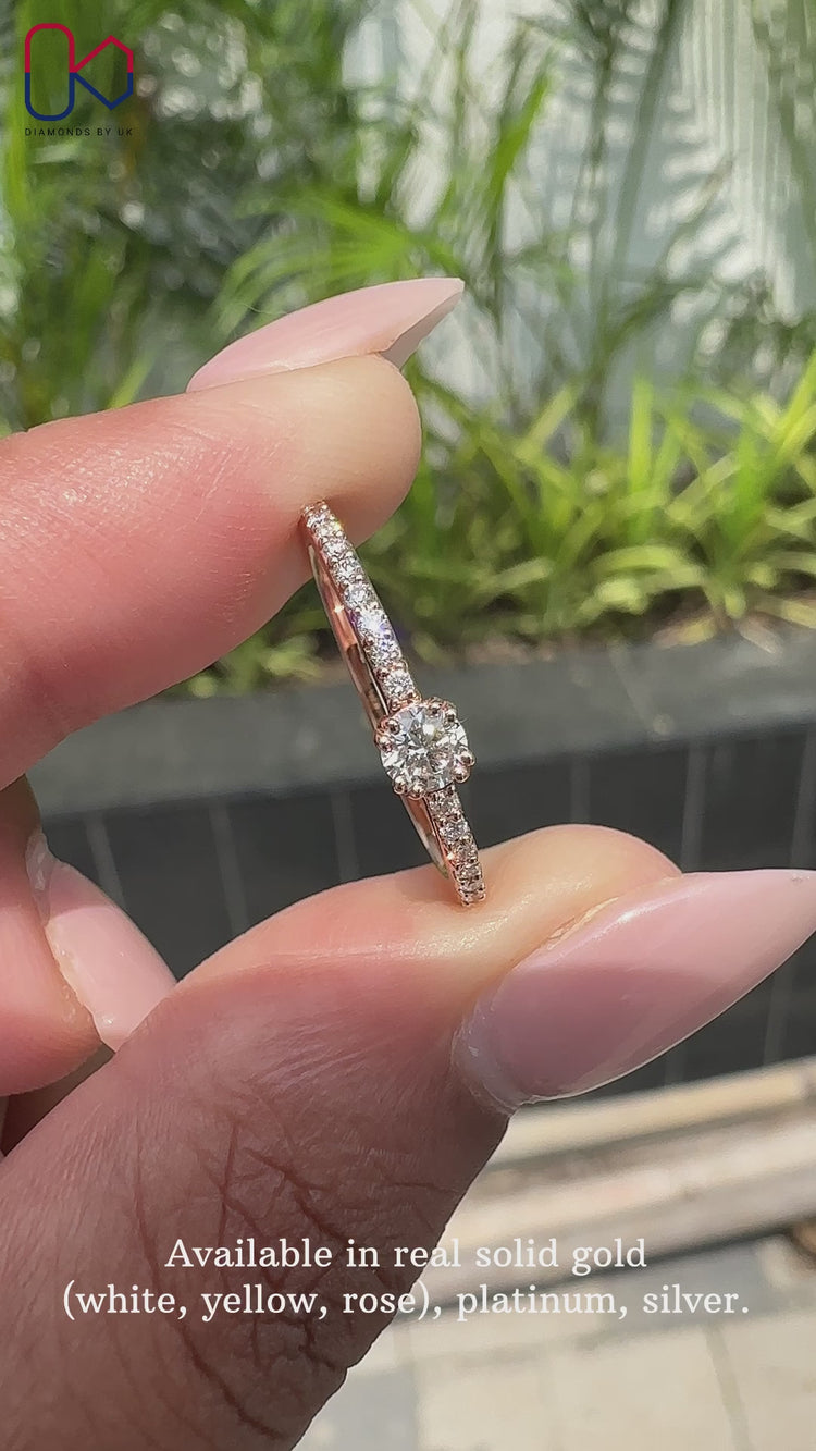 Round diamond engagement ring set in a beautiful rose gold ring band.
