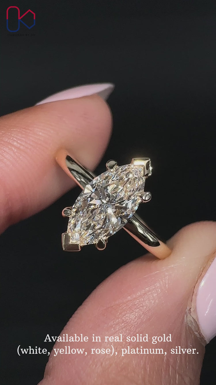Handmade marquise cut solitaire ring design.